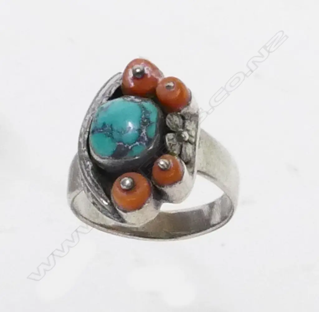 A Navajo silver coral and turqoise ring Image 1++