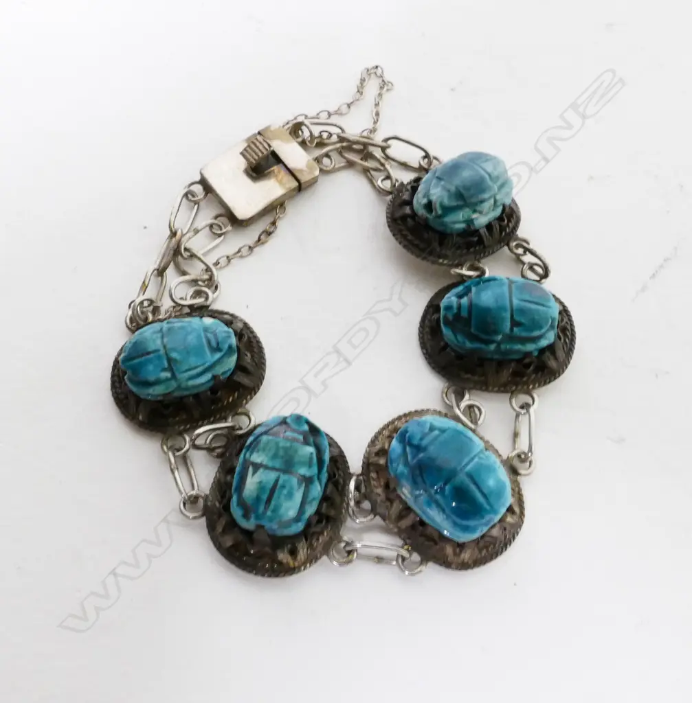A silver and turquoise scarab bracelet Image 1++