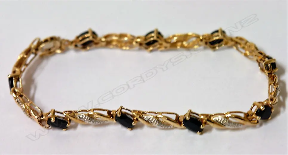 A lady's 9ct. yellow gold sapphire and diamond set bracelet Image 1++