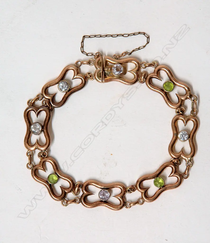 A c.1900 rose gold peridot and white sapphire bracelet Image 1++
