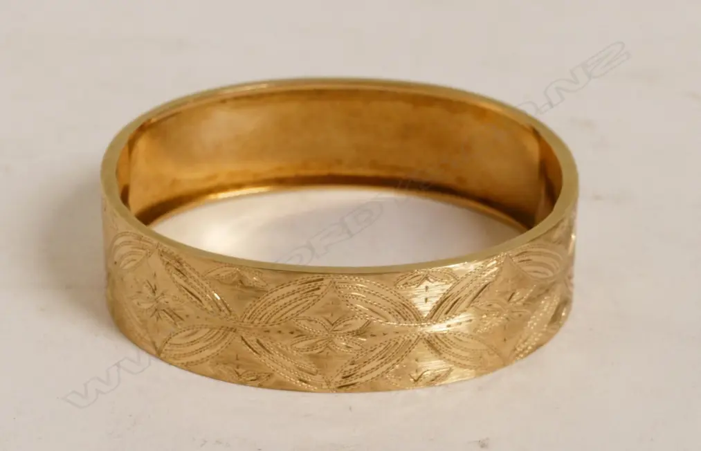 A 14ct. rose gold hinged bangle Image 1++