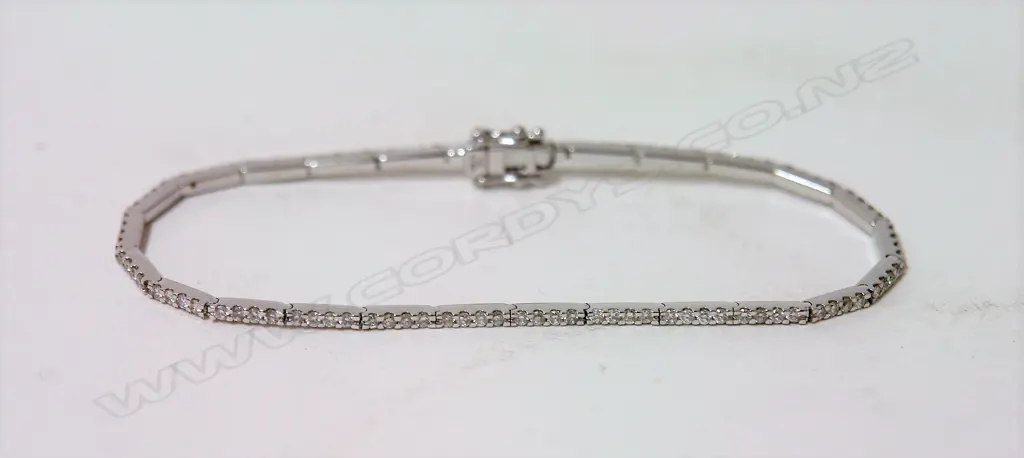 An 18ct. white gold and multi-diamond fine tennis bracelet Image 1++