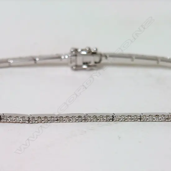 An 18ct. white gold and multi-diamond fine tennis bracelet