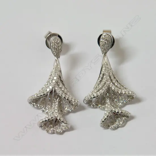 A pair of elegant modern lady's 18ct. white gold and diamond articulated bell flower earrings