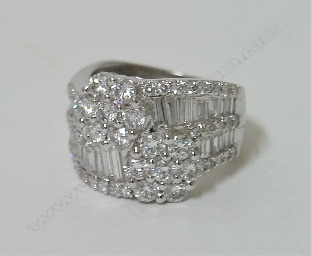 An 18ct. white gold and multi-diamond cluster lady's dress ring Image 1++