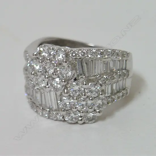 An 18ct. white gold and multi-diamond cluster lady's dress ring