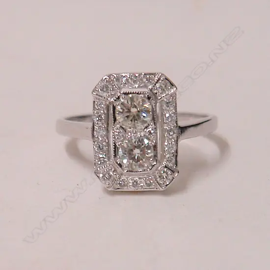 A lady's 18ct. white gold Art Deco style diamond cluster ring