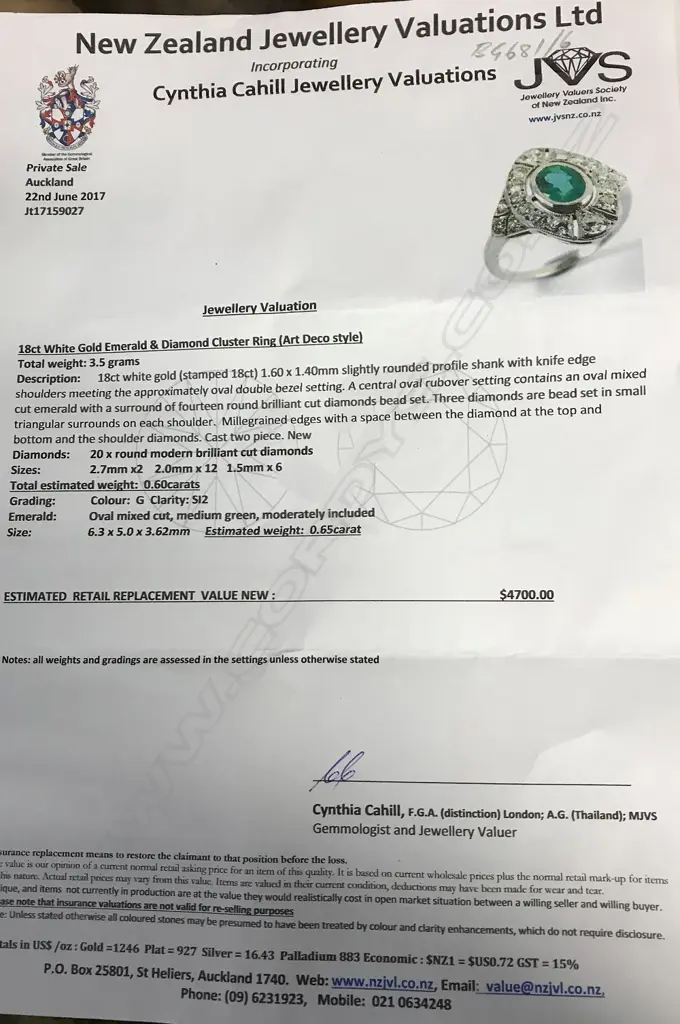 An 18ct. white gold Art Deco style emerald and diamond cluster ring Image 1++