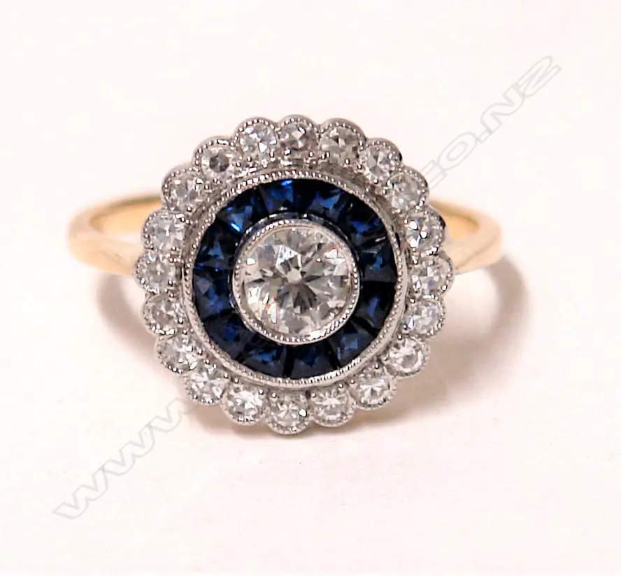 An 18ct. yellow and white gold Art Deco style diamond and sapphire cluster ring Image 1++