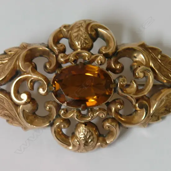 An antique 9ct. yellow gold and citrine large brooch