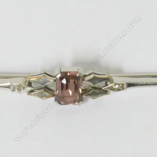 An Art Deco platinum and 9ct. white gold bar brooch