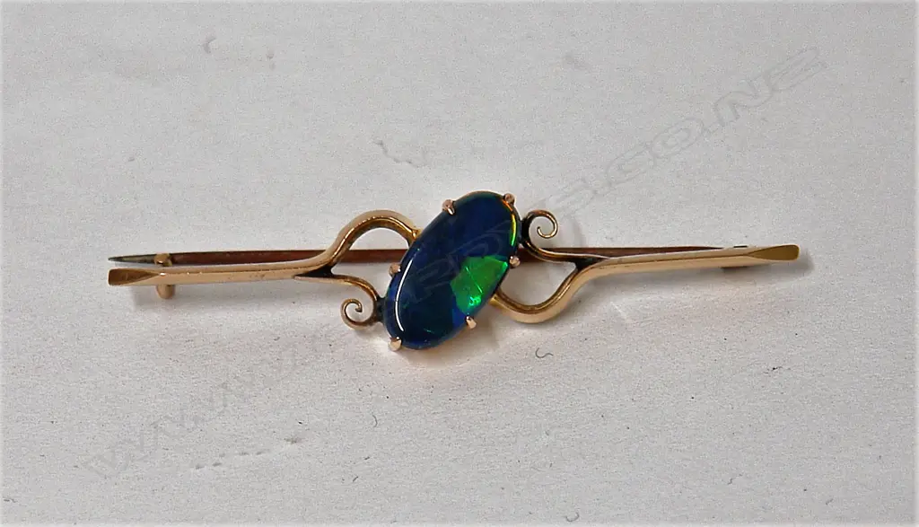 A vintage natural bright dark toned opal and 15ct yellow gold brooch Image 1++