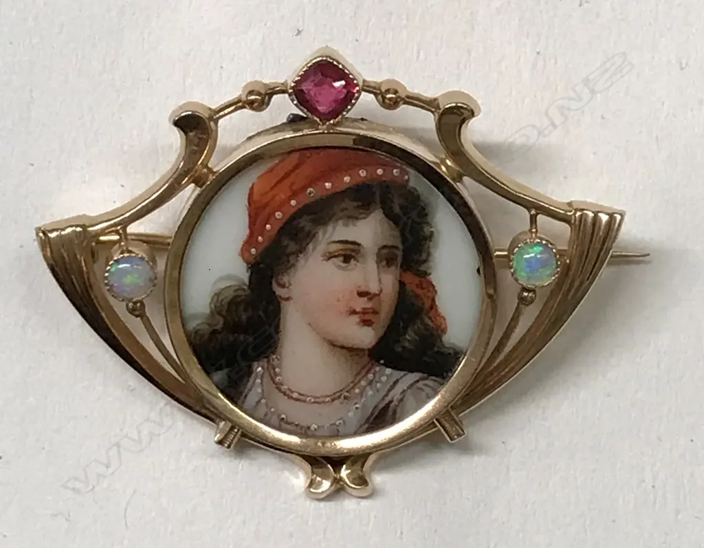 A 14ct. rose gold gem set picture brooch Image 1++