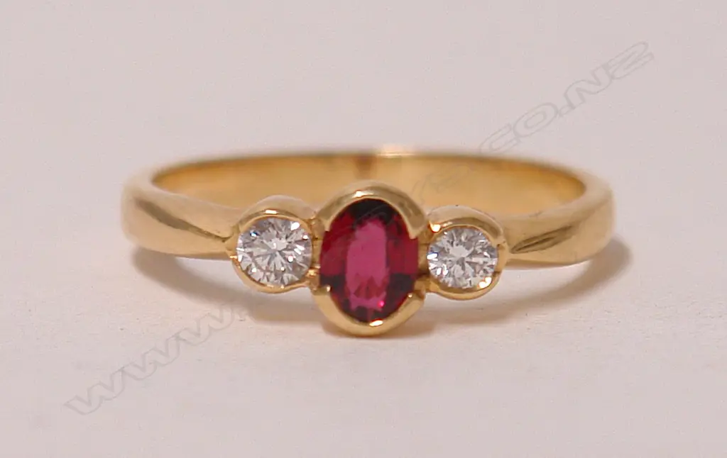 A modern lady's 18ct. yellow gold ruby and diamond dress ring Image 1++