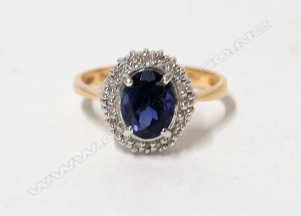 A 9ct. modern diamond and iolite dress ring Image 1++