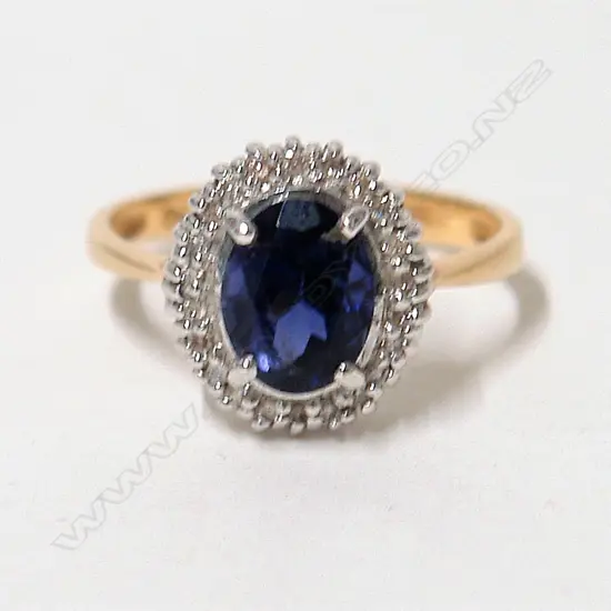 A 9ct. modern diamond and iolite dress ring