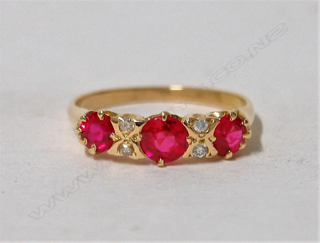 An 18ct. yellow gold estate diamond and synthetic ruby ring Image 1++