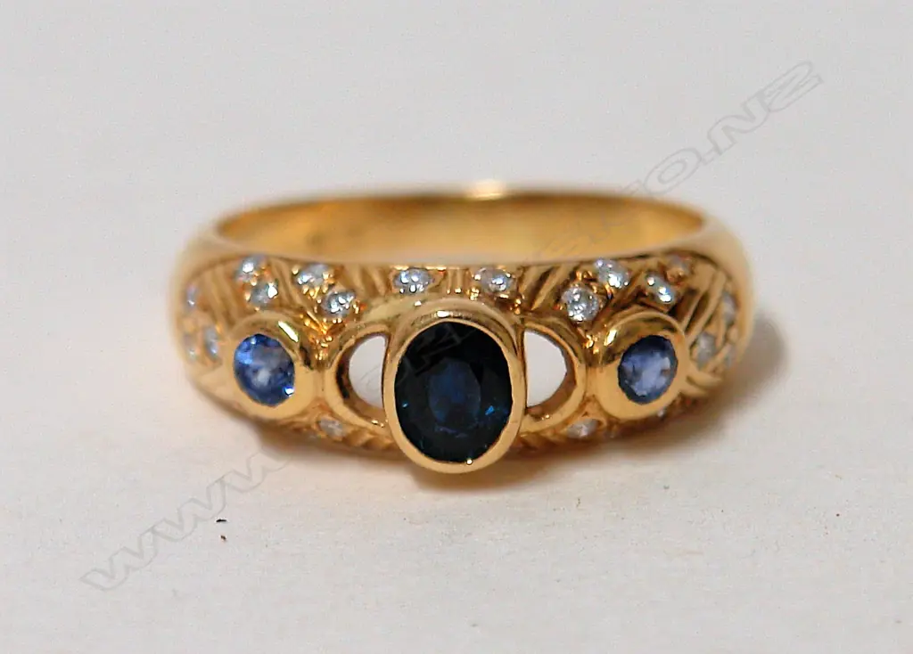 An 18ct. yellow gold sapphire and diamond lady's dress ring Image 1++