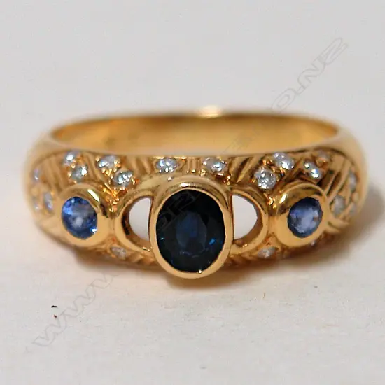 An 18ct. yellow gold sapphire and diamond lady's dress ring
