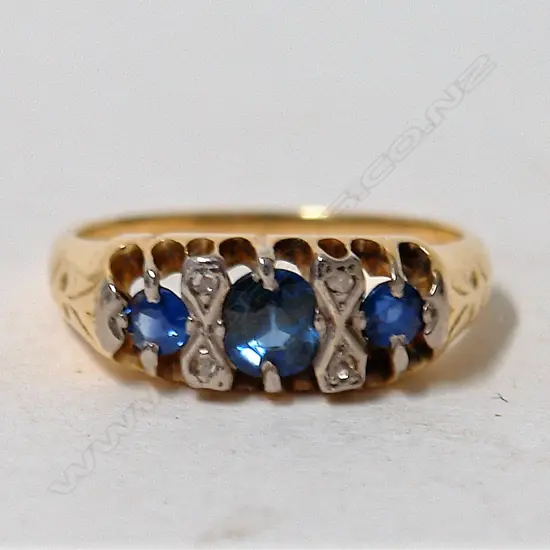 An estate 18ct. yellow gold natural sapphire and diamond ring