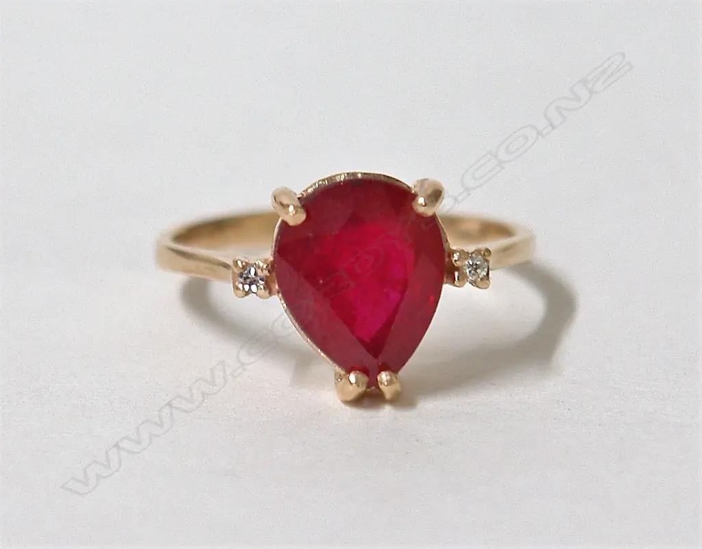 A modern lady's 9ct. yellow gold ruby and diamond dress ring Image 1++