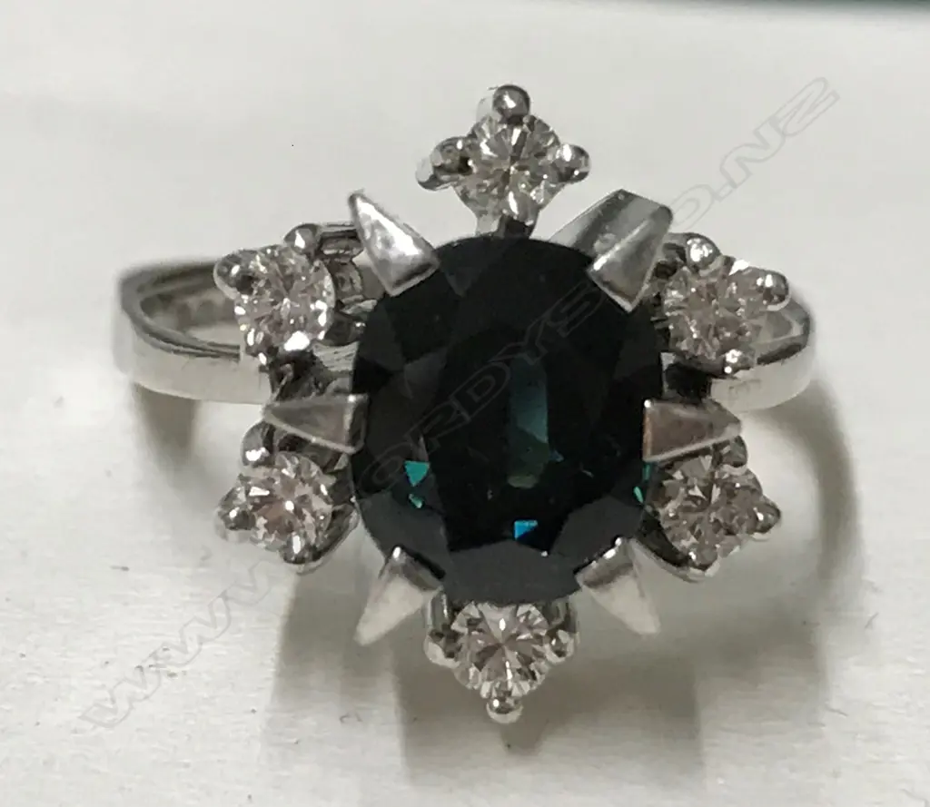 A 14ct. white gold sapphire and diamond ring Image 1++