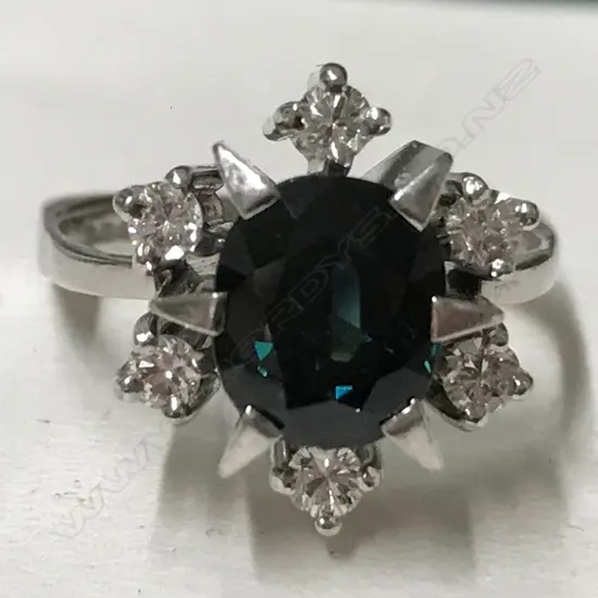 A 14ct. white gold sapphire and diamond ring