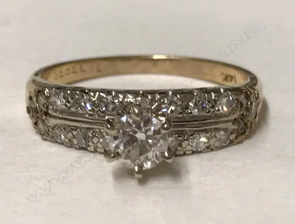 A 14ct. gold and diamond ring Image 1++