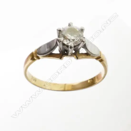 An estate 18ct. gold and diamond solitaire ring
