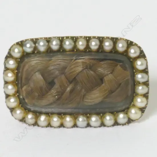 A George III rose gold seed pearl and hair plait mourning brooch