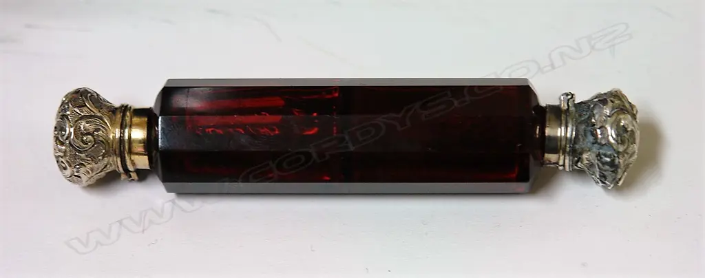 A Victorian silver and ruby glass double ended scent bottle Image 1++