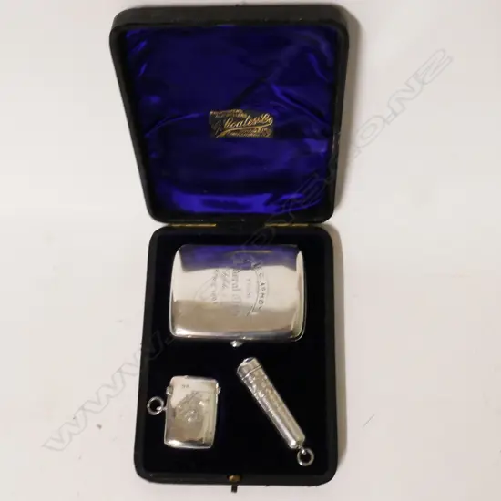 An Edwardian cased three piece silver smoker's suite