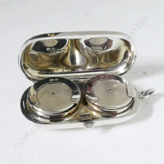 A silver double sovereign case