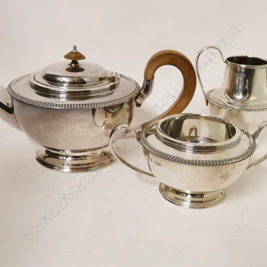 A silver three-piece tea set