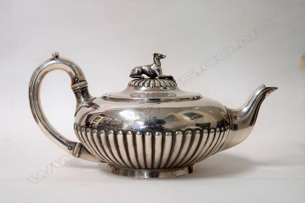 A heavy Victorian silver teapot with greyhound finial Image 1++