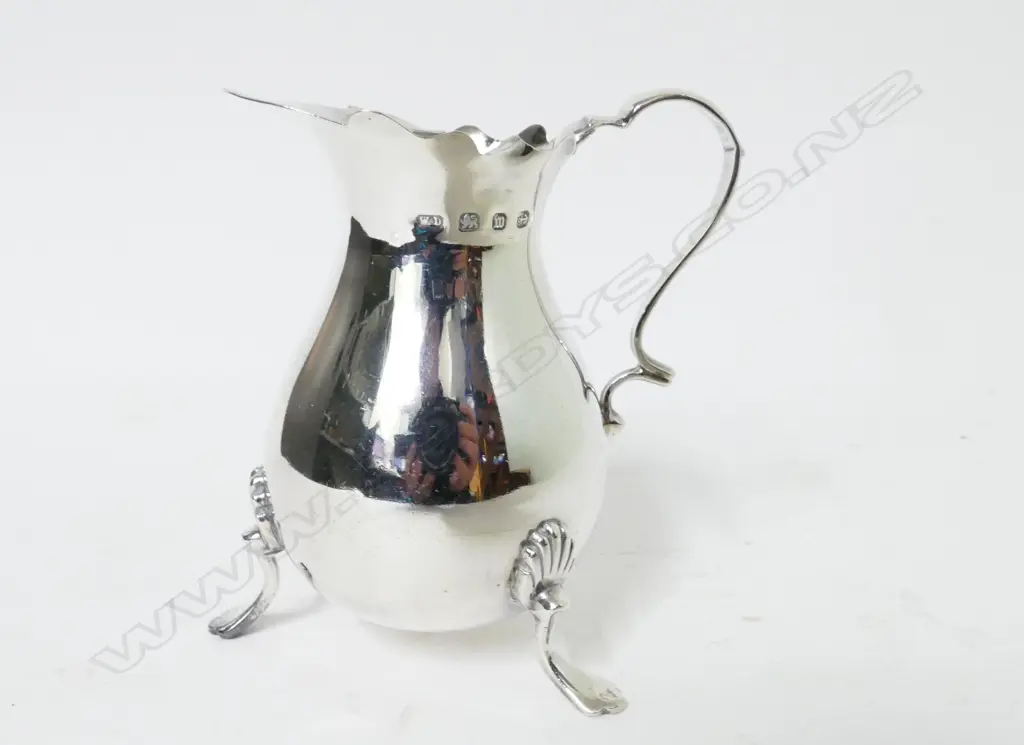 A Georgian style pear shaped cream jug Image 1++