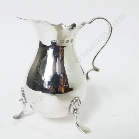 A Georgian style pear shaped cream jug