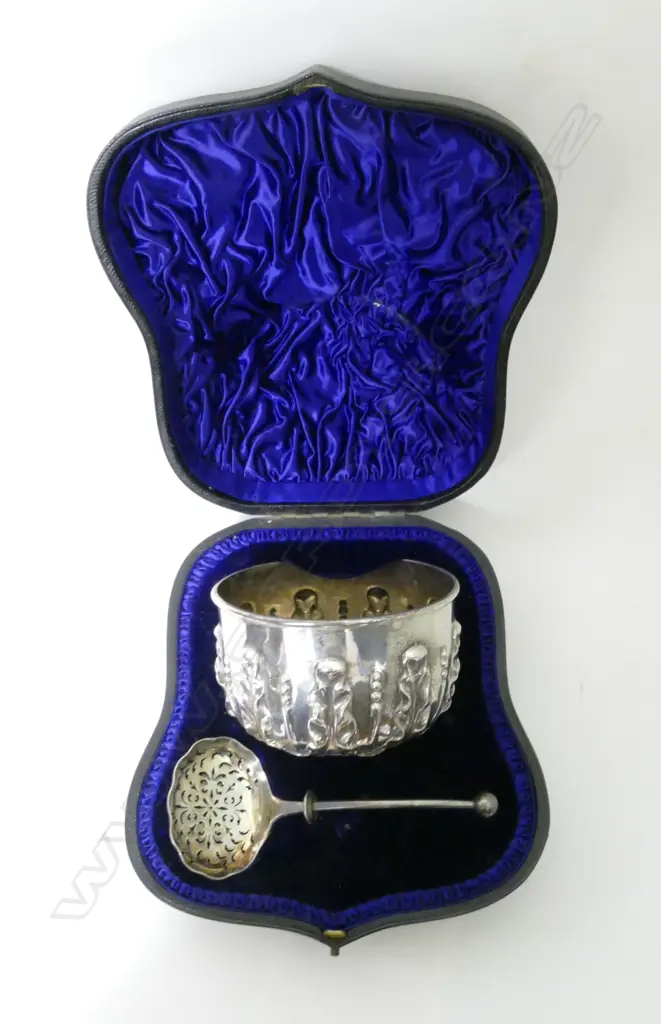 A Victorian silver sugar bowl and sifter spoon in case Image 1++