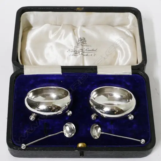 A pair of silver salts and spoons