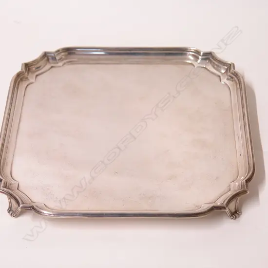 A 1930s silver square form salver