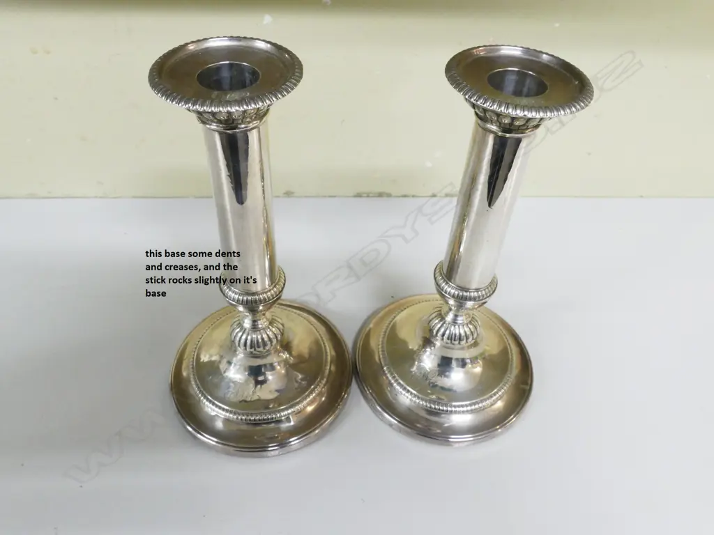A pair of George III silver candlesticks Image 1++