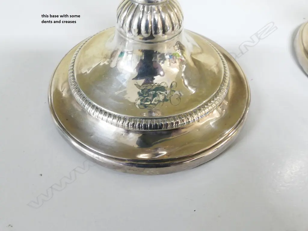 A pair of George III silver candlesticks Image 1++