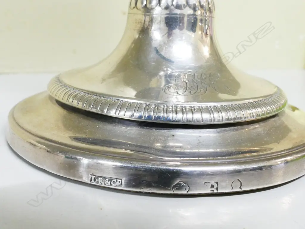 A pair of George III silver candlesticks Image 1++