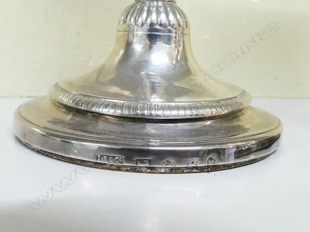 A pair of George III silver candlesticks Image 1++