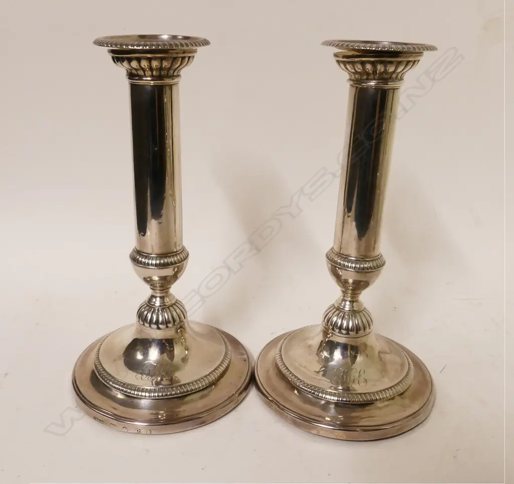 A pair of George III silver candlesticks Image 1++