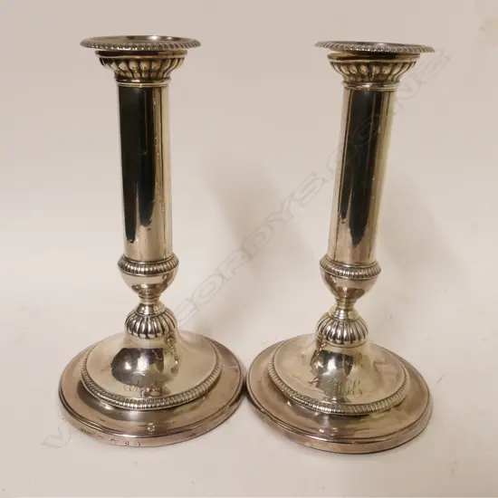 A pair of George III silver candlesticks