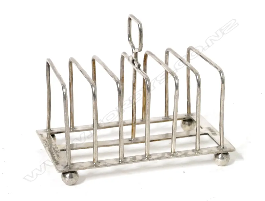 An Edwardian six-slice silver toast rack Image 1++