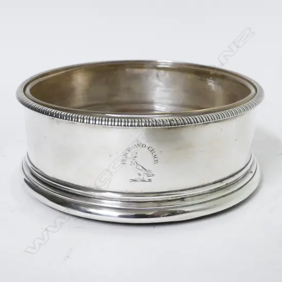A George III silver decanter coaster