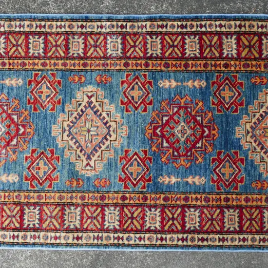 A hand knotted Afghan Kazak runner