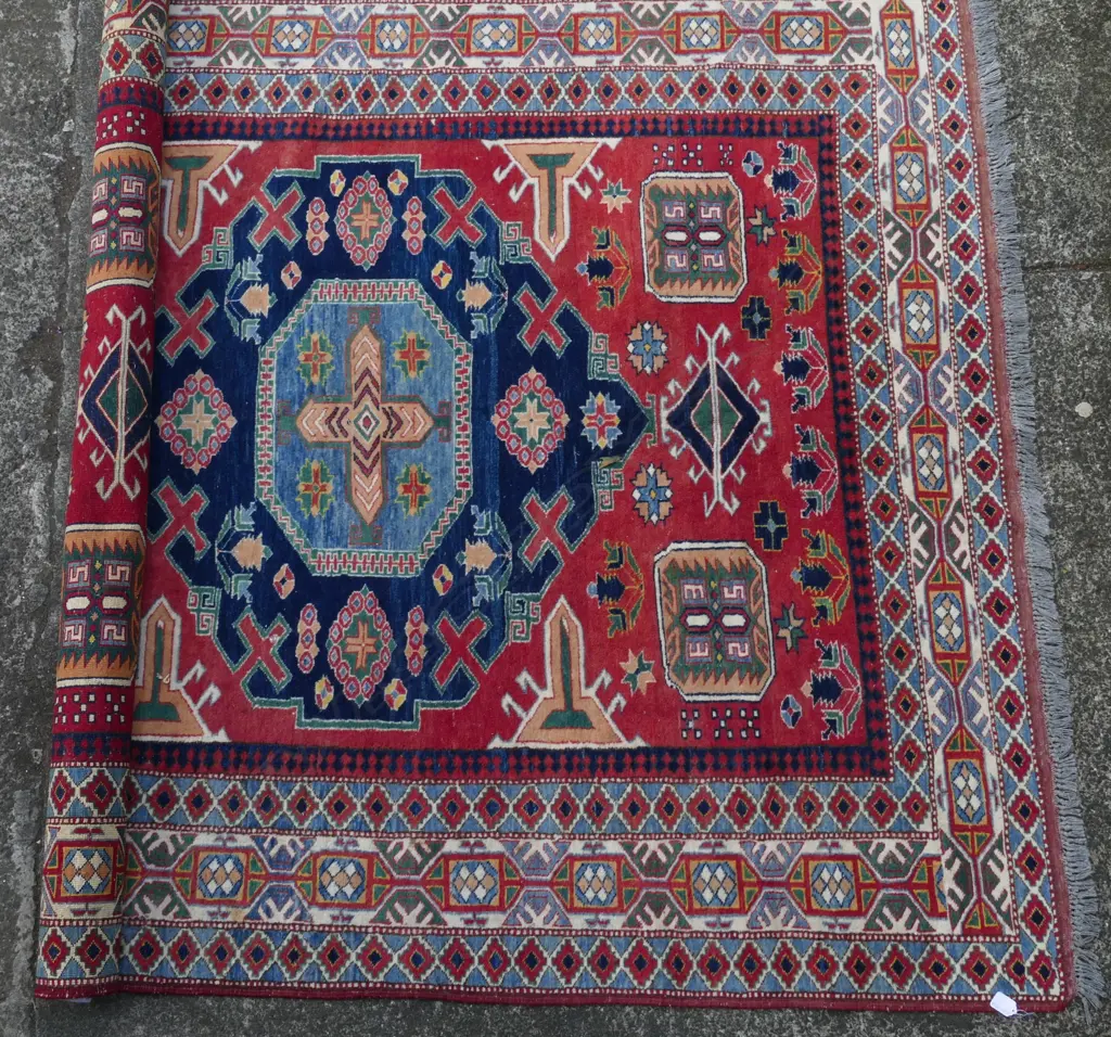 A hand knotted Kazak rug Image 1++